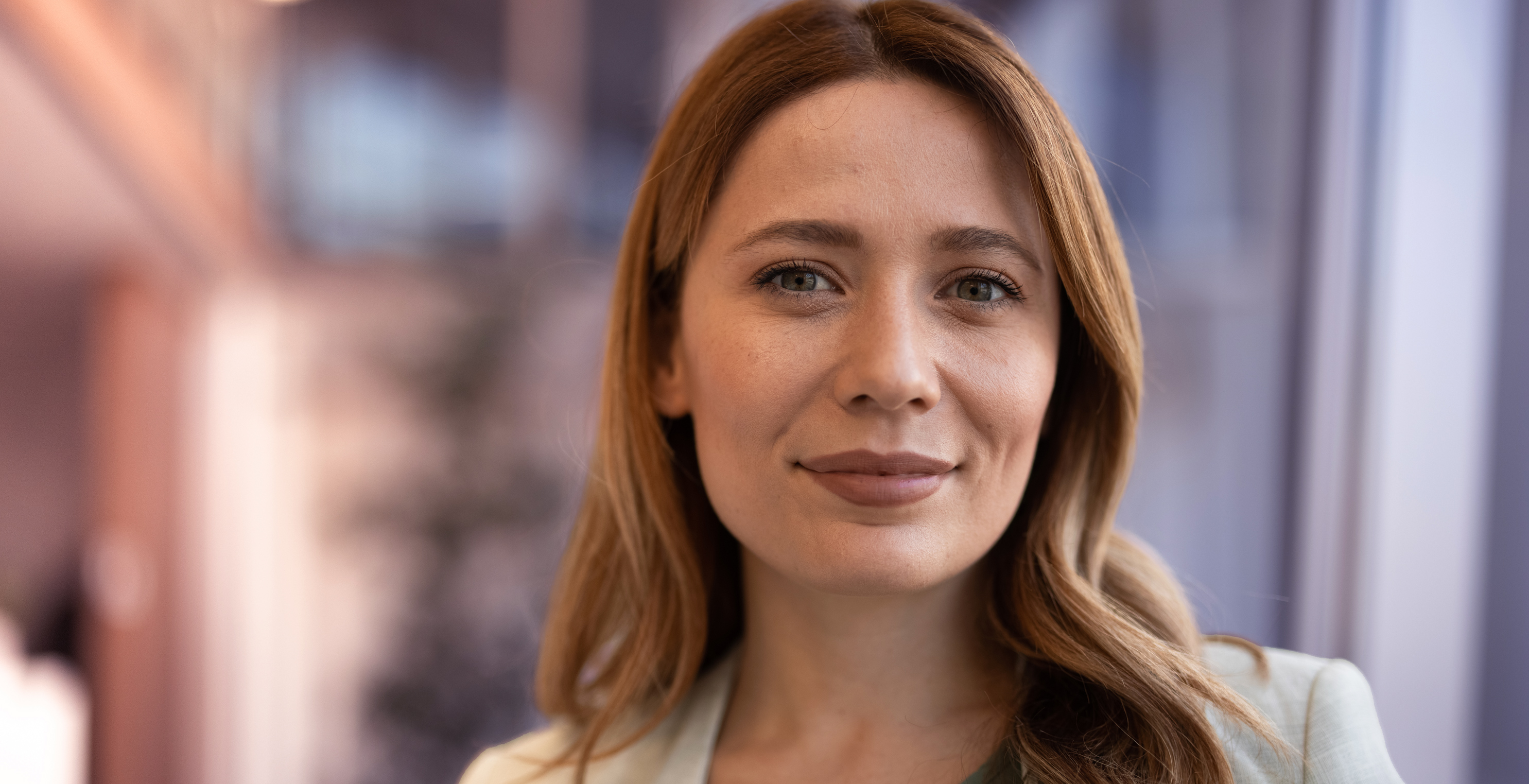 Smiling woman in her home office.